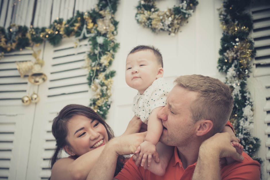 Happy family enjoying Christmas indoors with festive decorations.
