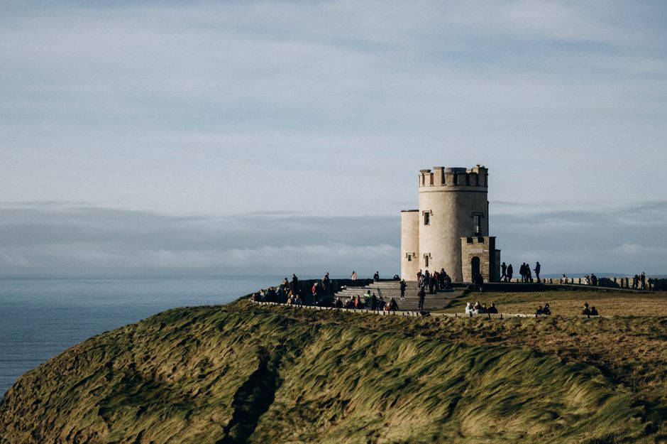 Scenic view of O'Brien's Tower on the Cliffs of Moher, a popular tourist attraction in Ireland.