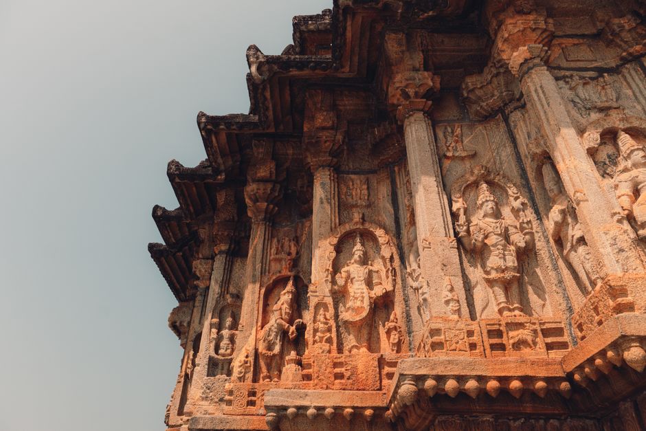 A close-up of detailed stone carvings on an ancient temple in Sringeri, Karnataka, India.